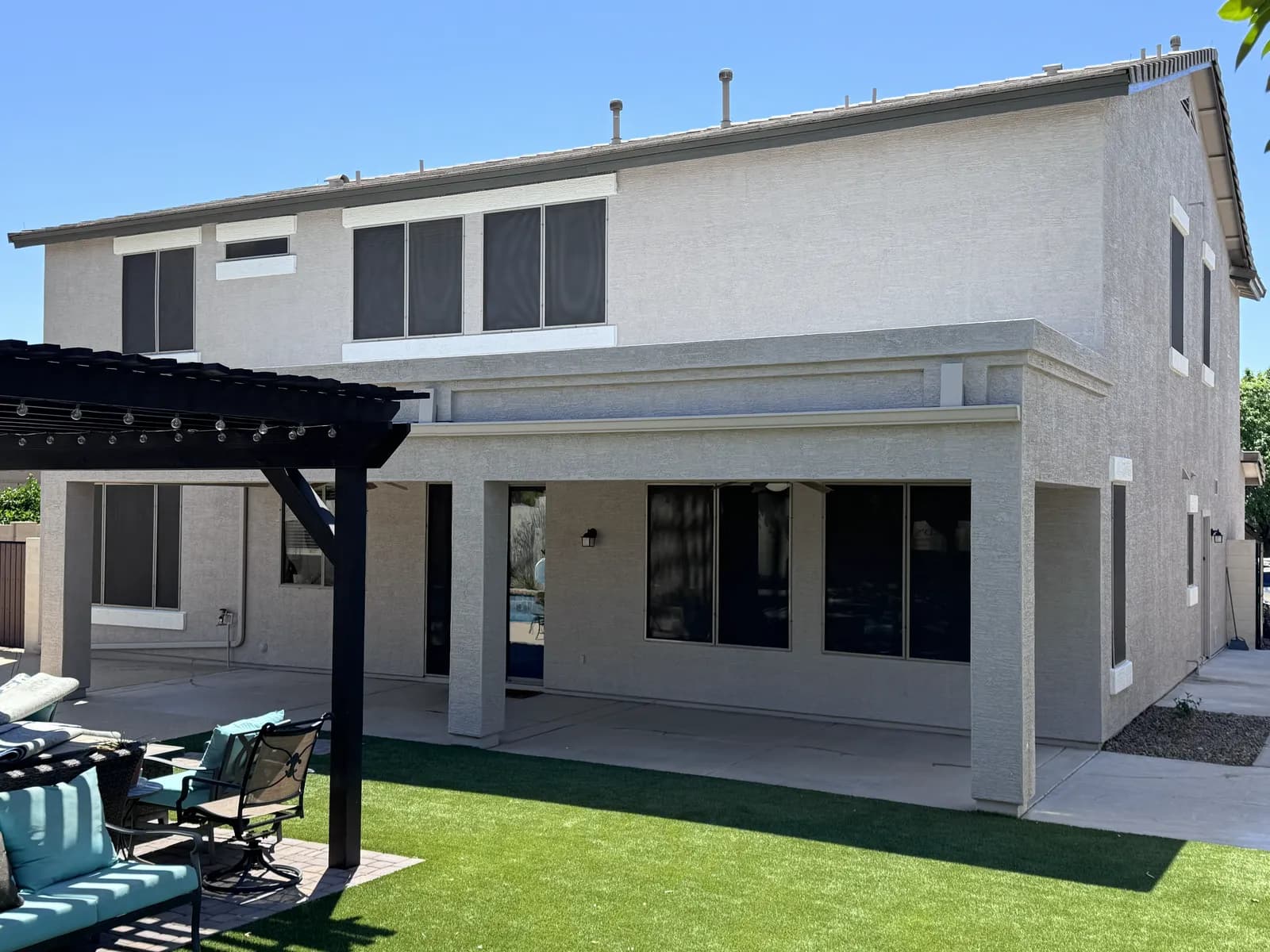 A clean, freshly painted covered patio and exterior wall — finished work by Valley Painting Pros.