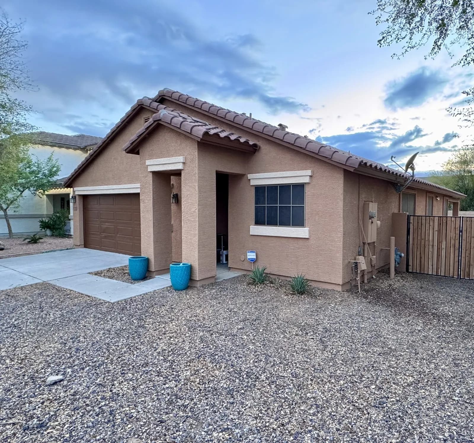 A tan single-story East Valley home freshly repainted by Valley Painting Pros.